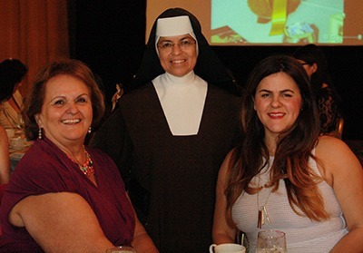 From left: Sylvia Mora-Ona, Carmelite Sister Caridad, principal of St. Theresa School, and Emily Hofer pose during the annual Friends of Carmel Luncheon to benefit the ministries and the apostolates of the Carmelite Sisters of the Most Sacred Heart of Lost Angeles.