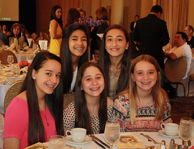 Sixth and seventh grade students from St. Theresa and Epiphany schools in Miami who heard former model Leah Darrow speak at the Friends of Carmel luncheon included, from left: Gianna Esposito, Alessia Guerrazzi, Camille Castellon, Melissa Herrero, and Diber Marie DiGregorio.