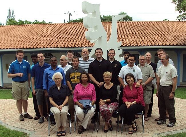 Participants in this year's Spanish Language and Culture Immersion course pose for a photo on the SEPI campus with Piarist Father Rafael Capo, standing, center, and their SEPI teachers and staff.