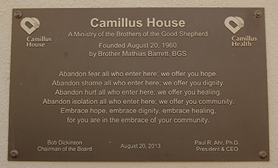 Plaque at the intake Center of Camillus House urges people to let go of fear and shame.