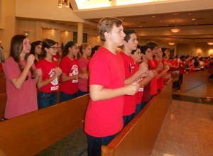 After a Mass in remembrance of September 11, 2001, students from St. Bonaventure School sang and interpreted "God Bless America" with Sign Language.