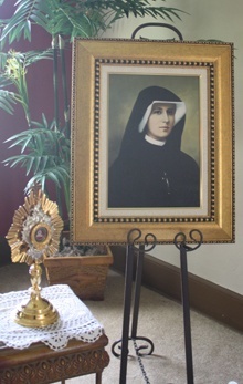 A relic and image of Sister Faustina are prominently displayed at the House of Prayer of Divine Mercy.