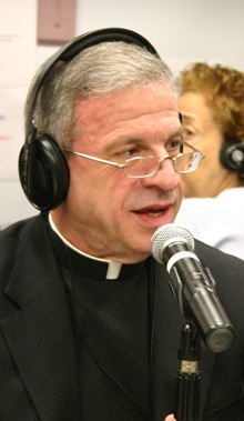 Msgr. Pablo Navarro goes on the air at Radio Paz the morning it was announced that he had been appointed president of Pax Catholic Communications, the archdiocesan entity that oversees Radio Paz.
