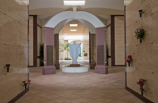 This statue of Christ the King welcomes visitors to the chapel and mausoleum at Our Lady Queen of Heaven Cemetery in North Lauderdale.