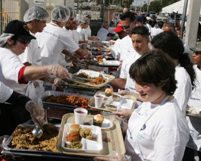 Camillus House staff and volunteers serve the hungry during 2008's Thanksgiving Day dinner.