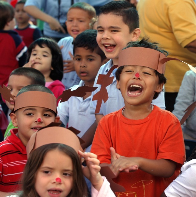 Kids cheer as Santa Claus arrives at the Good Shepherd Day Care Center in Perrine Dec. 14.